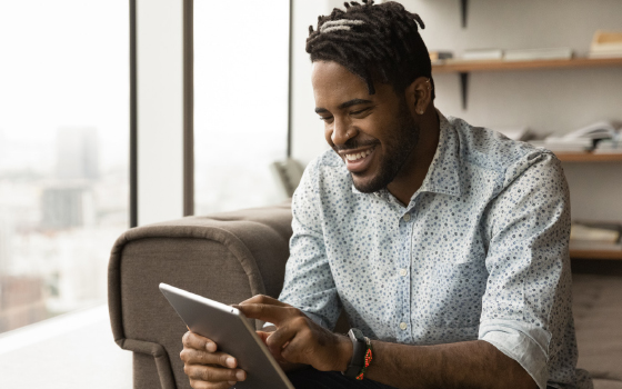 Man looking at tablet